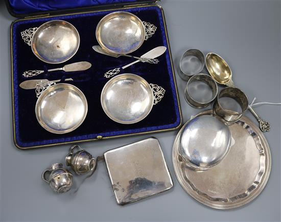 A set of four silver quaich-style butter dishes and knives, cased and sundry small silver,